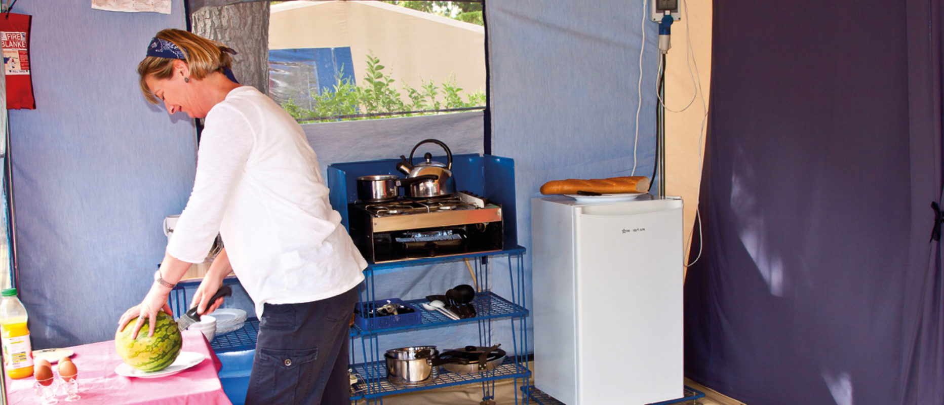 Tent lady in kitchen