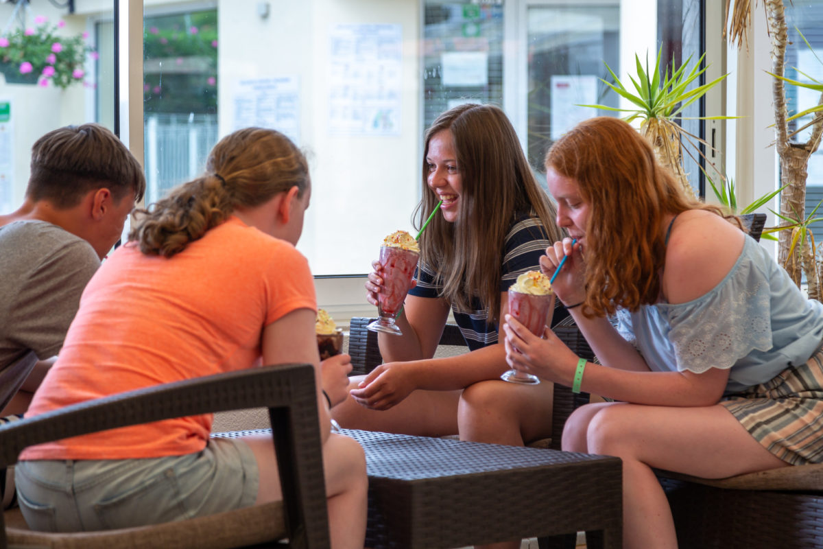 Young people with milkshakes